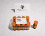 NAD+ 500mg/vial research supplement in orange bottles for science use.