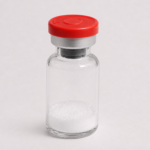 Clear glass vial with white powder and red cap for peptide research.