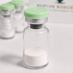 Vial of white peptide powder with green cap for peptide synthesis.